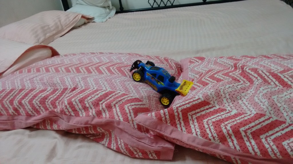 A racing car on a racing track of pillows